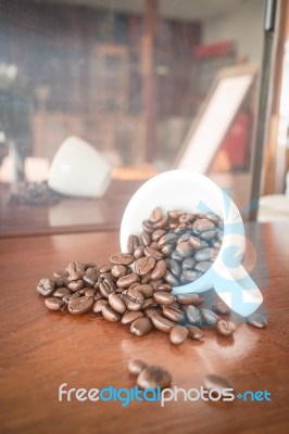 Roast Coffee Bean In White Mug Stock Photo