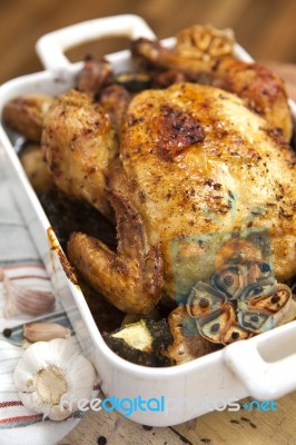 Roasted Chicken With Garlic And Potatoes Stock Photo