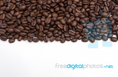 Roasted Coffee Beans On White Stock Photo