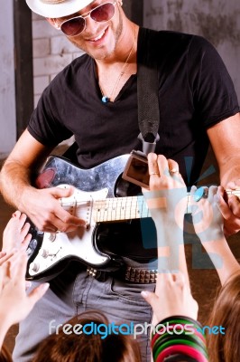 Rock Guitarist In Action Stock Photo