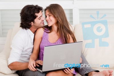 Romantic Couple With Laptop Stock Photo