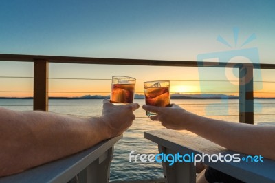 Romantic Evening Cocktails On Seaside Deck Stock Photo