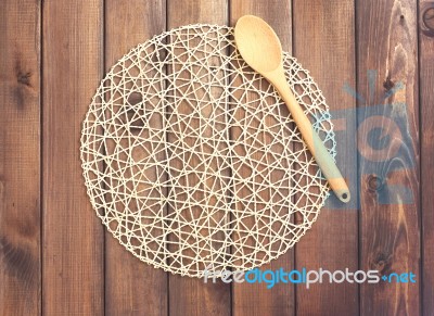 Round Rope Napkin Or Stand And Spoon On A Wooden Rustic Table. T… Stock Photo