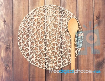 Round Rope Napkin Or Stand And Spoon On A Wooden Rustic Table. T… Stock Photo