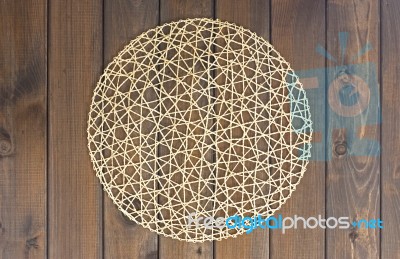 Round Rope Napkin Or Stand On A Wooden Rustic Table. To Create A… Stock Photo