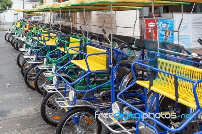 Row Of Four Wheeled Bikes In Santa Barbara Stock Photo