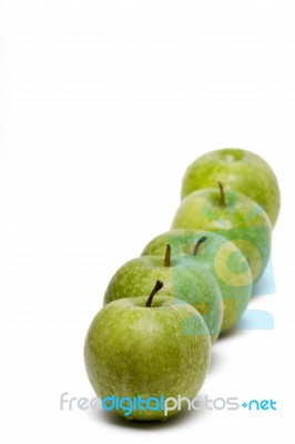 Row Of Fresh And Healthy Green Apples Stock Photo