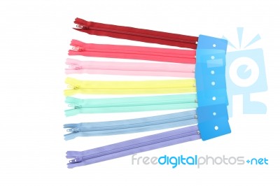 Row Of Multiple Color Zipper Spread On White Background Stock Photo