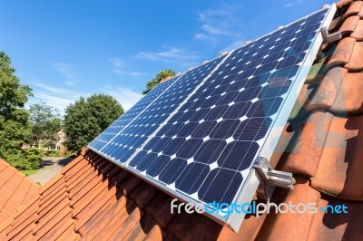 Row Of Solar Panels  On Roof Stock Photo