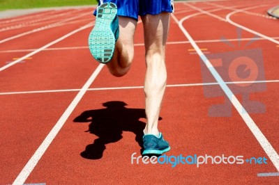 Runner Practicing On A Race Track Stock Photo