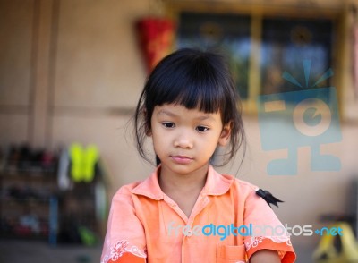 Sad Little Girl Holding Her Face Stock Photo