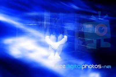 Sad Or Fear Woman Sitting Alone In Dark Place,ghost In Haunted House Stock Photo