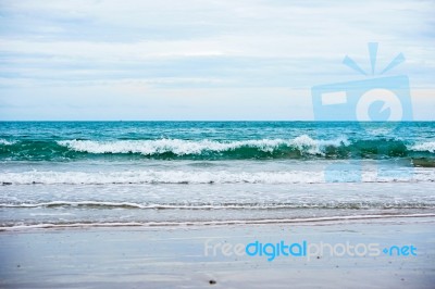 Sand Beach With Blue Ocean Stock Photo