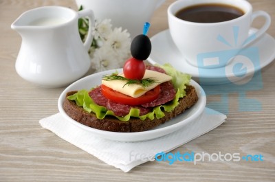 Sandwich With A Cup Of Coffee And Milk Stock Photo