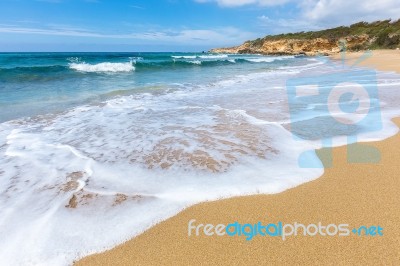 Sandy Beach Sea Waves And Mountain At Coast Stock Photo