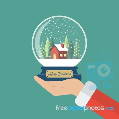 Santa Claus Hand Holding Christmas Glass Ball Stock Image