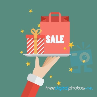 Santa Claus Serving A Present And Shopping Bag Stock Image