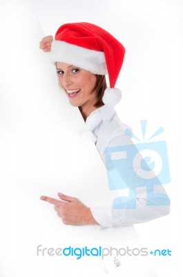 Santa Girl Pointing At Billboard Stock Photo