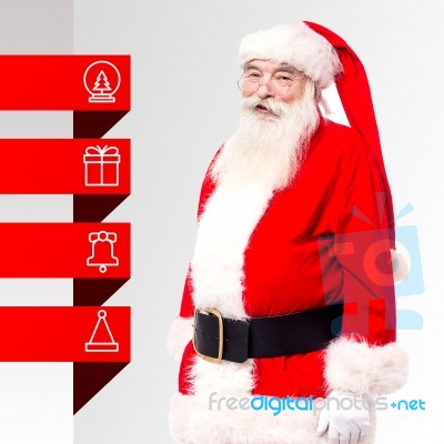 Santa Standing With X-mas Tags Stock Photo