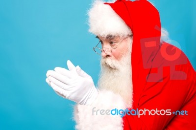 Santaclaus About To Blow Snow Stock Photo