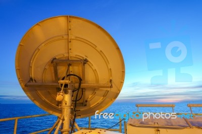 Satellite Dish On Back Side On Offshore Platform With Sky Stock Photo