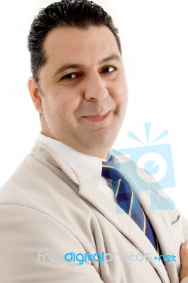 Satisfied Businessman Looking At Camera Stock Photo