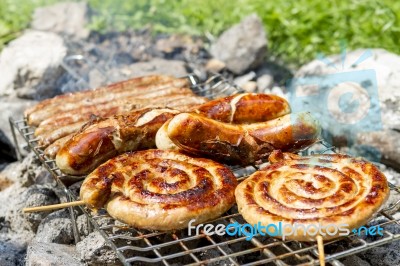 Sausages On Grill Outdoor Stock Photo