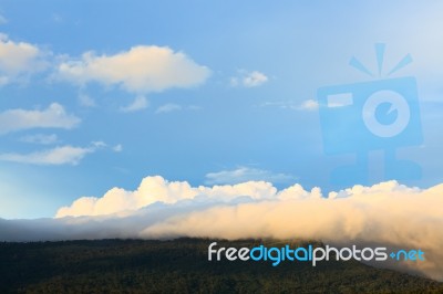 Scenic Of Clouds Over Mountain Stock Photo