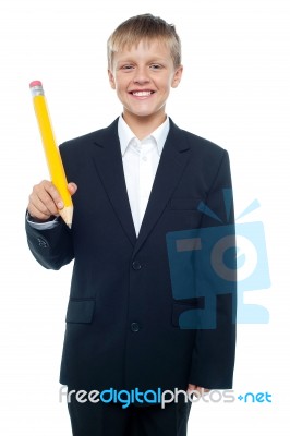 School Boy Holding Pencil Stock Photo