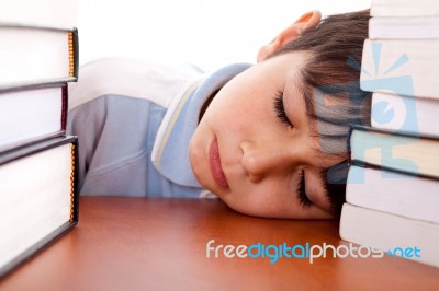 School Boy Sleeping On Table Stock Photo