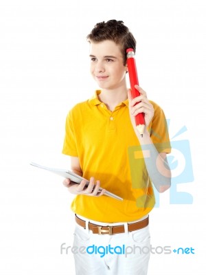 School Boy Trying To Recall Answer Stock Photo