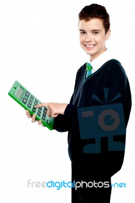 School Boy Using Calculator Stock Photo