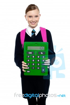 School Girl Holding Large Green Calculator Stock Photo