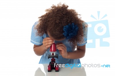 School Girl Using Microscope Stock Photo