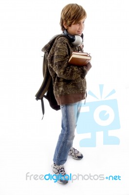 Schoolboy With Books And Bag Stock Photo