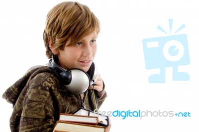 Schoolboy With Headset And Books Stock Photo