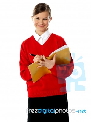 Schoolgirl Writing Stock Photo