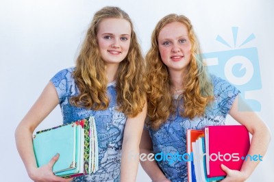 Schoolgirls Carrying Textbooks Stock Photo