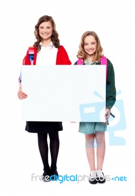 Schoolgirls Holding Blank Banner Stock Photo