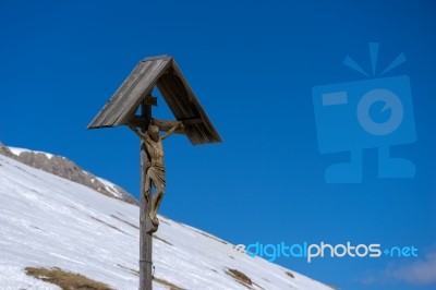 Sculpture Of Jesus On The Cross At Pordoi Stock Photo