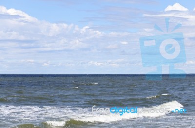 Sea Under Blue Summer Sky Stock Photo