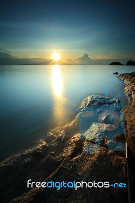 Seascape Sunsset With Fantastic Rock Surface Stock Photo