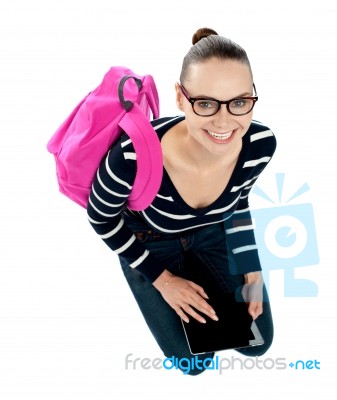 Seated College Girl Using Table Pc Stock Photo