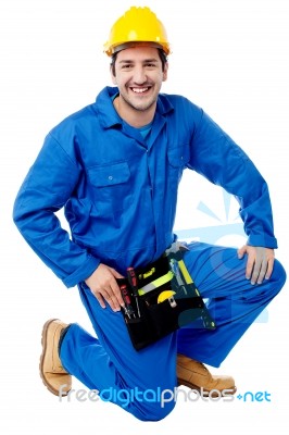 Seated Construction Worker Posing With A Smile Stock Photo