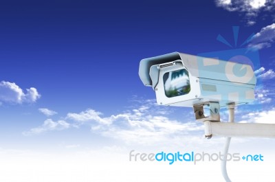 Security Camera Or CCTV On Blue Sky Stock Image