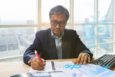 Senior Business Man Working On Office Table Stock Photo