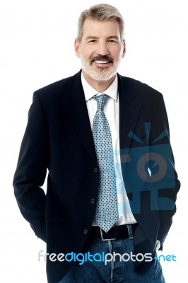 Senior Businessman Posing Casually Stock Photo