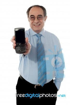 Senior Businessman With Blackberry Stock Photo