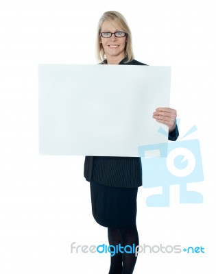 Senior Businesswoman Holding Board Stock Photo
