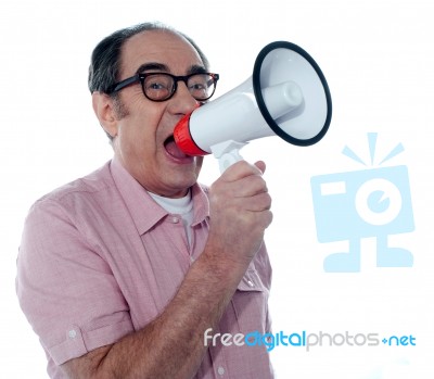 Senior Casual Man With Megaphone Stock Photo